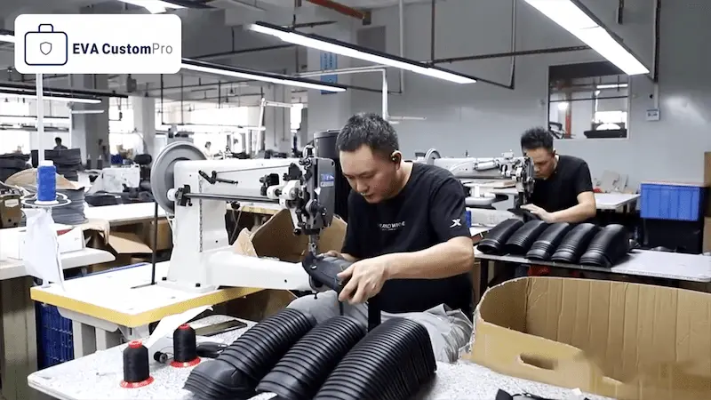 Skilled workers operating industrial sewing machines on the EVA CustomPro stitching production line for custom hard shell cases.