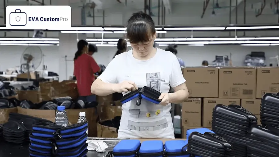 Quality inspector performing 100% full check on finished custom EVA hard shell cases at EVA CustomPro QC area.