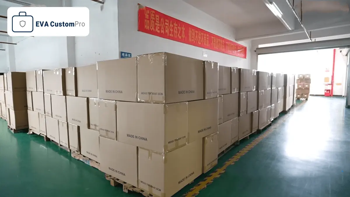 Organized warehouse area with palletized export cartons containing custom EVA cases at EVA CustomPro facility.