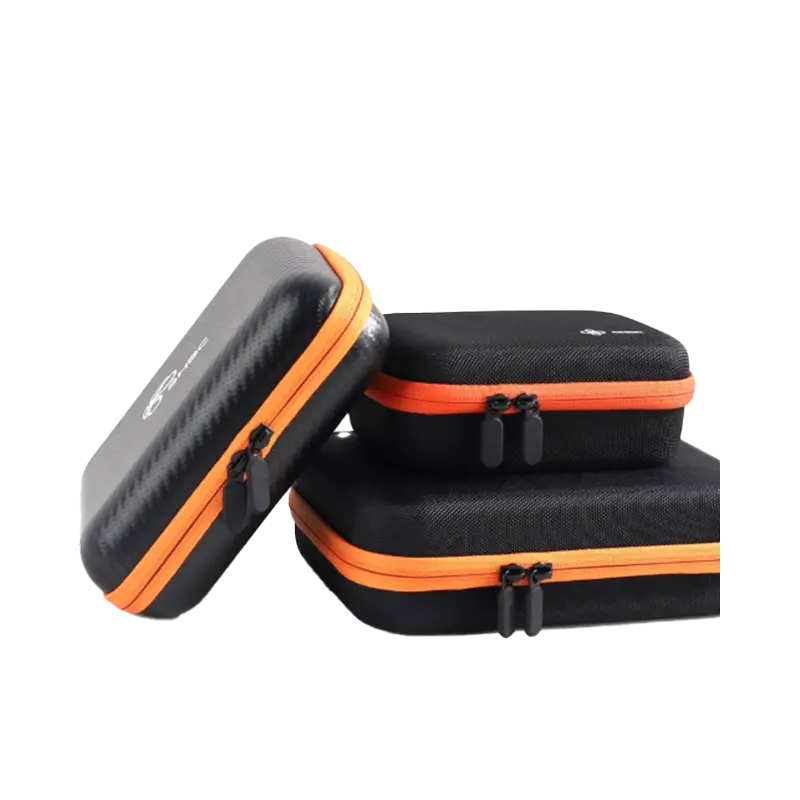 Variety of hard shell EVA carrying cases in multiple sizes with custom orange accent zippers.